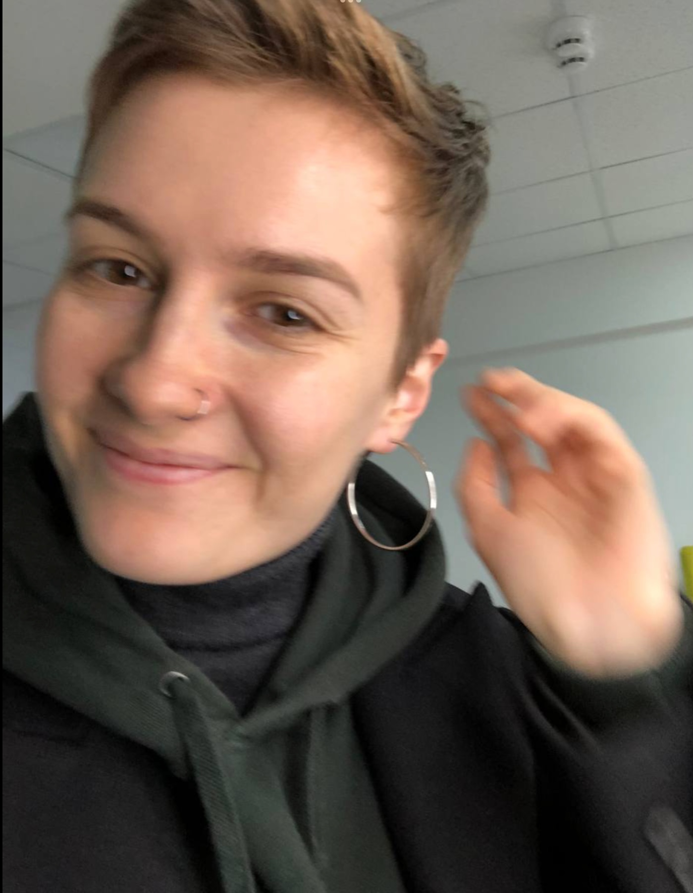 Before styling: close-up portrait with casual hoodie and hoop earring